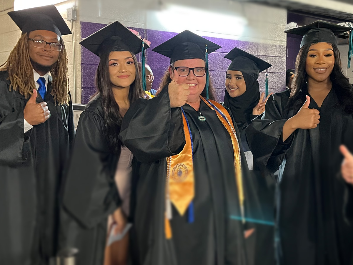 Group of proud graduates waiting for the commencement ceremony to begin.