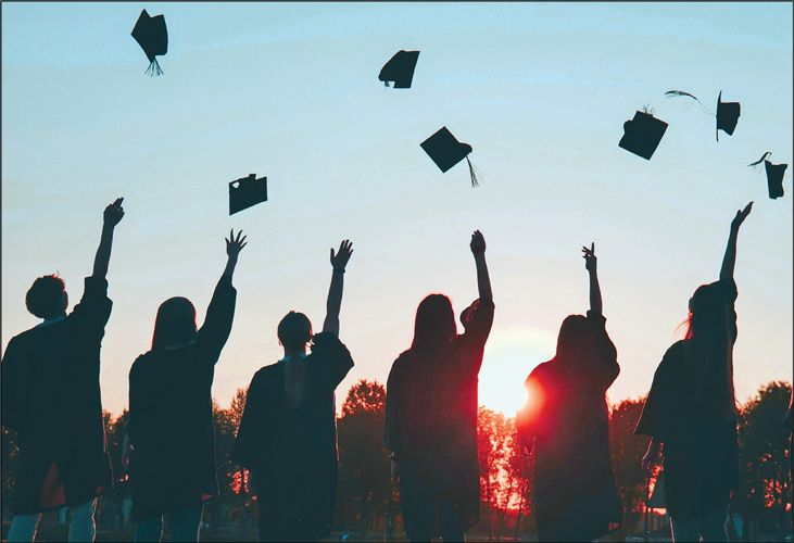 graduates celebrating - link to rehearsal and commencement information booklet