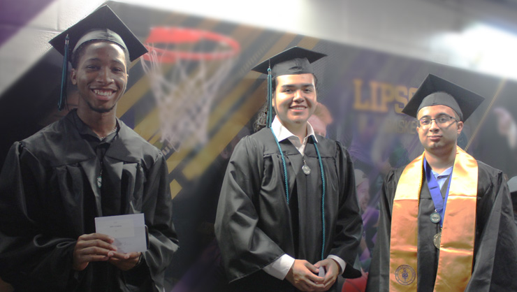 Three male students at Commencement