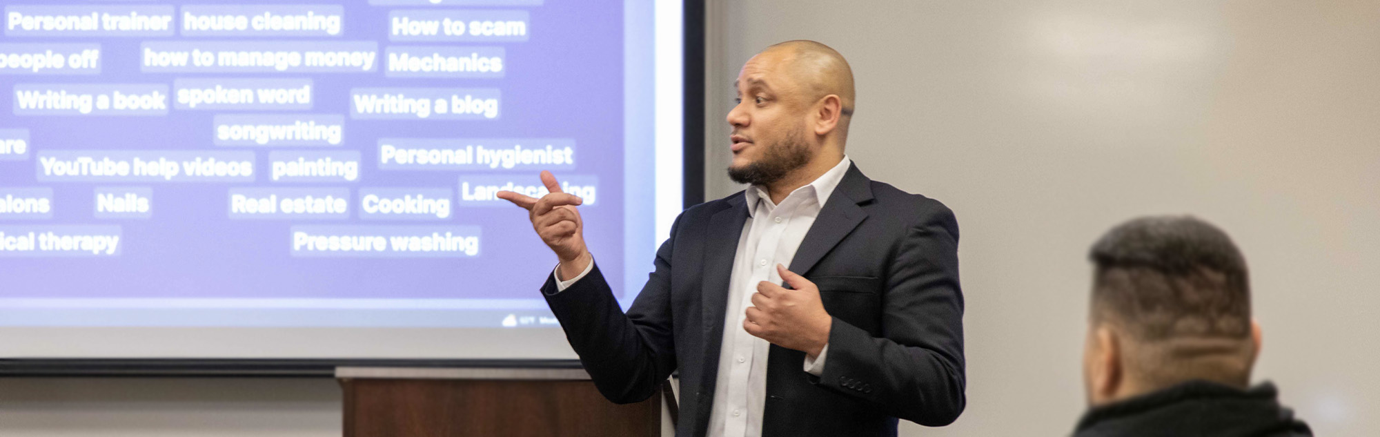 Communications instructor guides his class.