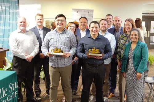 During a special ceremony on the college’s White Bridge campus, Nashville State graduates and current Cat Financial employees Jorge Rosario Agosto and Ramiro Valdez celebrated the completion of their apprenticeship program right where their journey began.