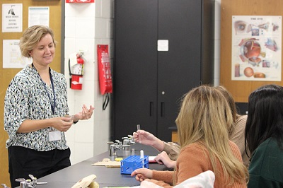 Professor Jessica Rabb with biology students in class.